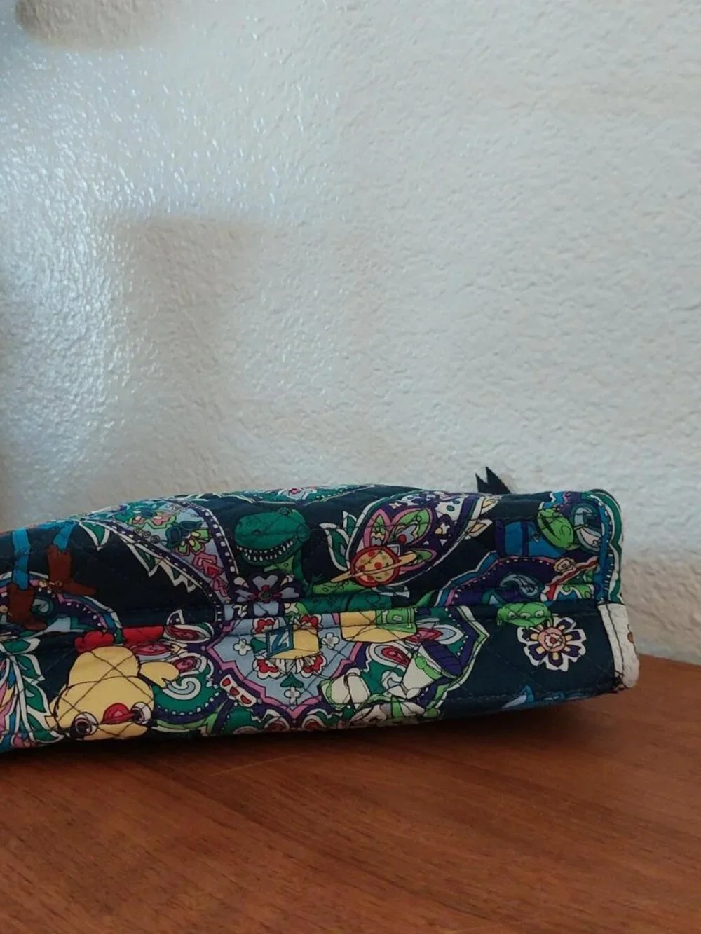 vera bradley Disney Toy Story quilted pouch with characters in a paisley design